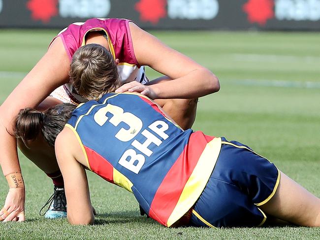 Foley is comforted by Brisbane opponent Dakota Davidson after injuring her knee in 2021. Picture: Getty