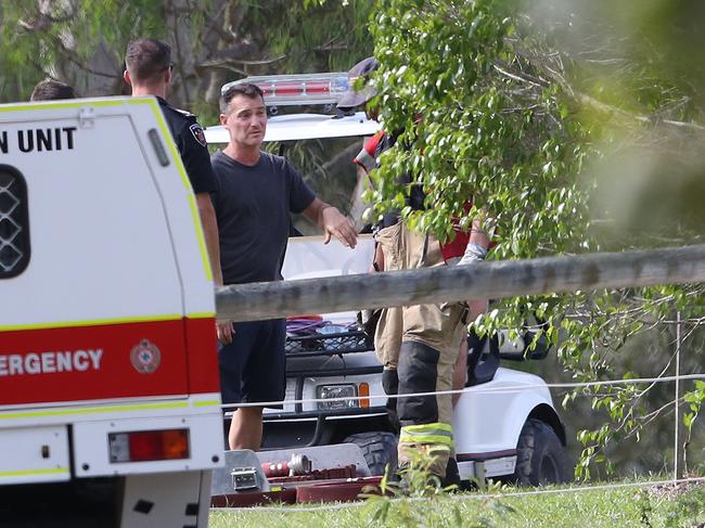 Country singer Adam Brand speaks to emergency services in Maudsland after his home was destroyed by fire. Picture: Glenn Hampson.