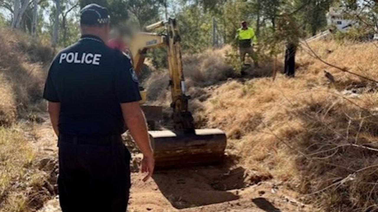 Queensland Police search a dry creek in Reward, near Rubyvale, where the human remains of Francis "Frank" Foley were found last year.