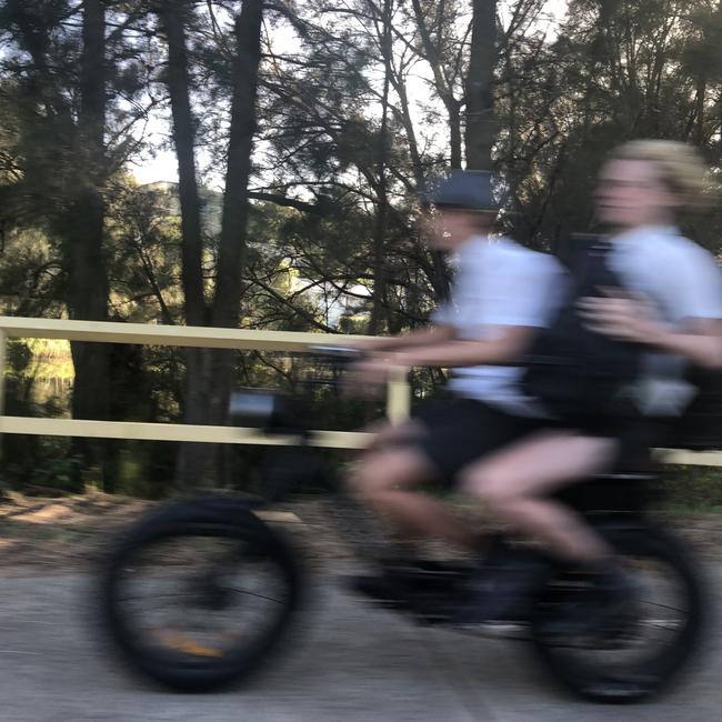 Secondary schools students on an e-bike on Pittwater Rd, Manly. Picture: Abby O'Rourke