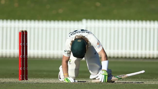 SYDNEY, AUSTRALIA - DECEMBER 08: Will Pucovski of Australia A lies injured after been struck in the helmet off the bowling of Kartik Tyagi of India A during day three of the International Tour match between Australia A and India A at Drummoyne Oval on December 08, 2020 in Sydney, Australia. (Photo by Jason McCawley/Getty Images)