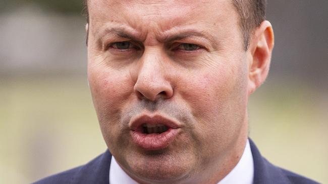 Treasurer Josh Frydenberg says counterpart Chris Bowen should apologise for his cane toad remarks. AAP Image/Daniel Pocket