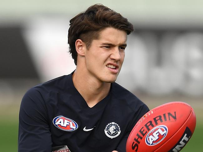 MELBOURNE, AUSTRALIA - MAY 13: Liam Stocker of the Blues handballs during a Carlton Blues AFL training session at Ikon Park on May 13, 2019 in Melbourne, Australia. (Photo by Quinn Rooney/Getty Images)