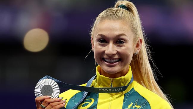 PARIS, FRANCE - AUGUST 10:  Silver medalist Jessica Hull of Team Australia celebrates on the podium during the Women's 1500m medal ceremony on day fifteen of the Olympic Games Paris 2024 at Stade de France on August 10, 2024 in Paris, France. (Photo by Al Bello/Getty Images)