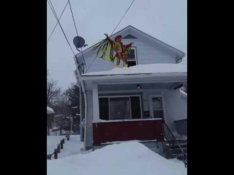 FUNNY:     Macho Man Randy Savage  Jumps From Rooftop Onto Snow   March 14