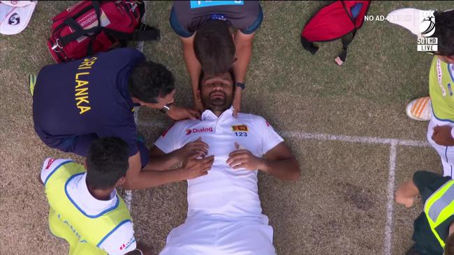 Medical staff assist Sri Lankan batsman Dimuth Karunaratne. Picture: Fox Cricket