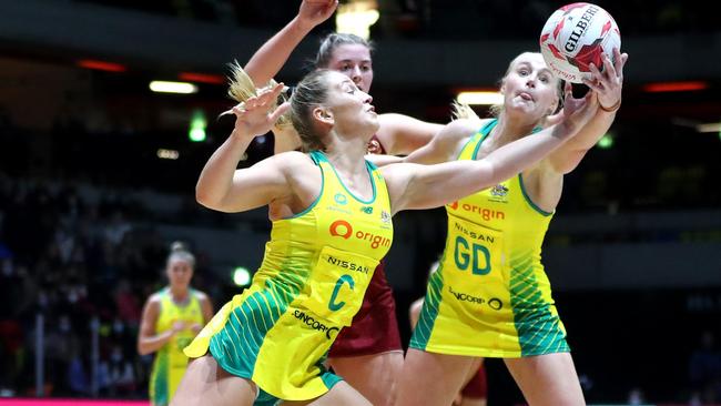 Jamie-Lee Price (left) and Joanna Weston of Australia both reach for the ball during the 2022 Netball Quad Series match between Australia and England. Photo: Getty Images