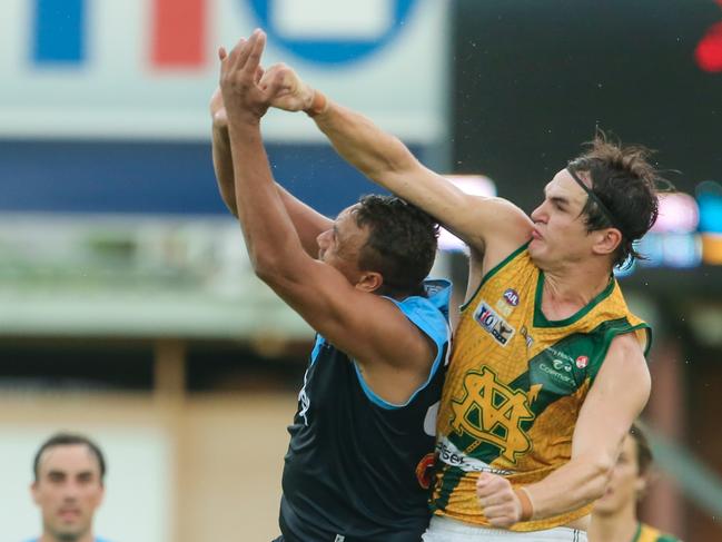 Buffs Daniel Stafford and Saints Thomas Davies as Saint Mary's take on Darwin Buffaloes at TIO Stadium.Picture GLENN CAMPBELL