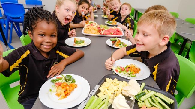 HOLD FOR HERALD SUN.  Mooroopna Park Primary School has been providing 160 students with breakfast, morning and afternoon tea and a hot lunch every day for almost a year, at no cost to families. Lots of community support financially and through food donations. Improving student attendance, engagement and academic results. Jasmine Elnour 6yrs (dark hair) and Oliver Carr-Webb 7yrs. Picture: Simon Dallinger