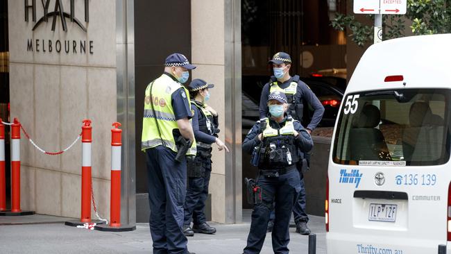 Police outside the Grand Hyatt Hotel in Melbourne which was used as a quarantine hotel for tennis players competing in the 2021 Australian Open. Picture: David Geraghty