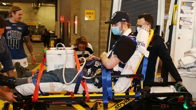 Angus arrives by ambulance for the game. Picture: Michael Klein.