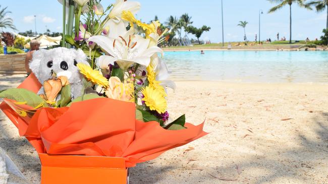 Tributes were left at Airlie Beach Lagoon after airline pilot Yuanwei Zhang and his son Chenxi, 5, of China, drowned on October 28, 2018.