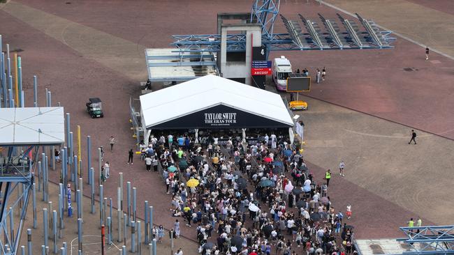 Taylor Swift fans are seen lining up for hours to get merchandise before the next concert, at the Homebush Stadium in Sydney.