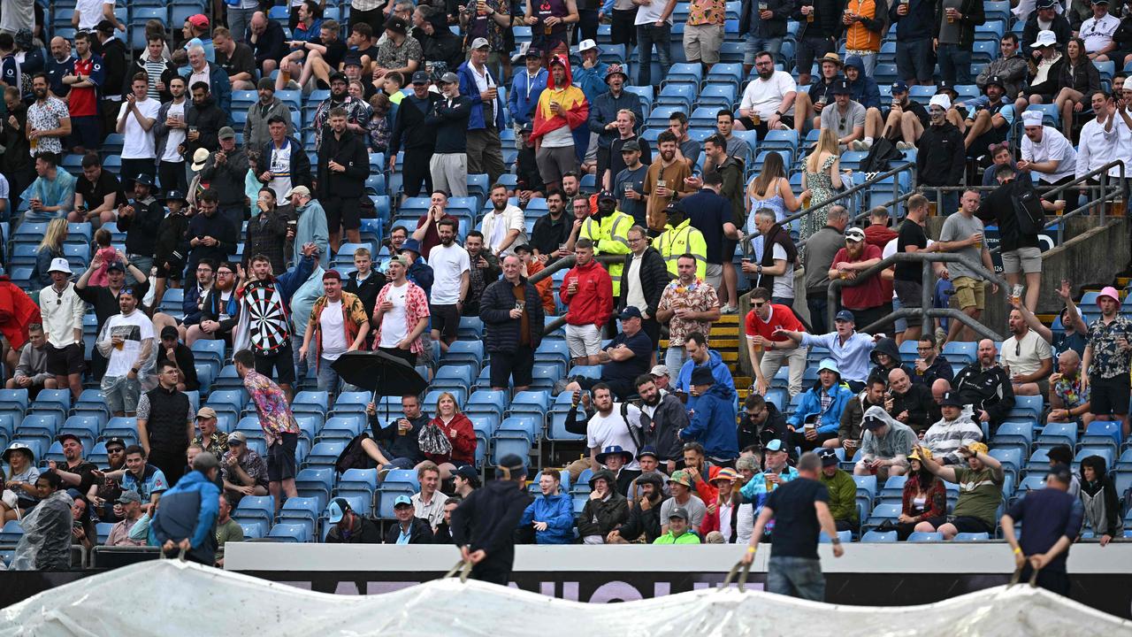 Fans cheer as the rain covers come off at Headingley - hopefully something that will be avoided on Sunday. Picture: AFP