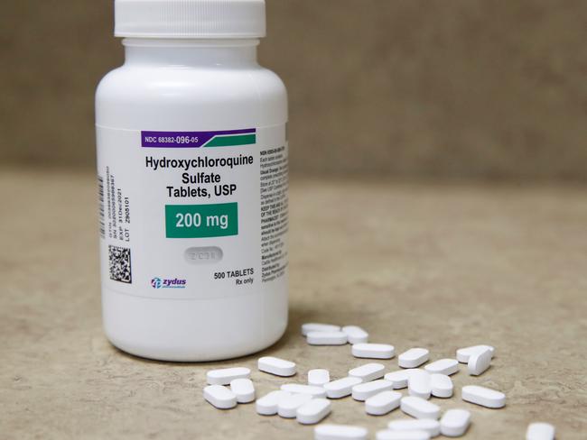 (FILES) In this file photo taken on May 20, 2020 a bottle and pills of Hydroxychloroquine sit on a counter at Rock Canyon Pharmacy in Provo, Utah. - The World Health Organization announced on June 3, 2020 that clinical trials of the drug hydroxychloroquine will resume as it searches for potential coronavirus treatments. On May 25, the WHO announced it had temporarily suspended the trials to conduct a safety review, which has now concluded there is "no reason" to change the way the trials are conducted. The UN health agency's decision came after a study published in The Lancet medical journal suggesting the drug could increase the risk of death among COVID-19 patients. (Photo by GEORGE FREY / AFP)