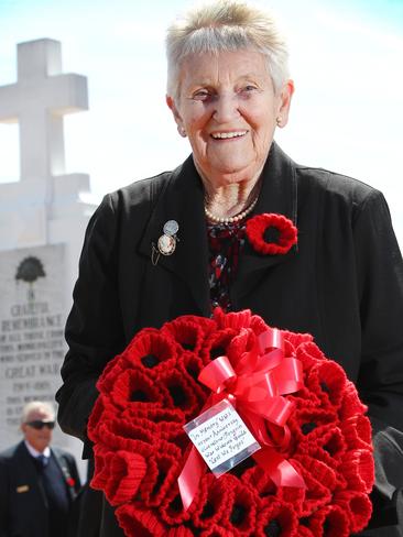 Ulverstone and Penguin War Widows Guild secretary Patricia Wilson holds her knitted poppy wreath after the Remembrance Day service at Penguin. Picture: CHRIS KIDD