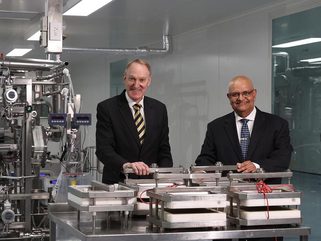 SYDNEY, AUSTRALIA - NCA NewsWire. September 22, 2020: Aegros co-founders John Manusu(Managing Director) (L) and Dr. Hari Nair(Chairman) (R) are pictured at a table with plasma cartridges for their ES-05(pictured in the background) which is a ElectroSeparation processing machine. It efficiently separates the immune proteins from blood plasma for Covid-19 research. They are pictured at Aegros new Sydney biotech processing facility in Macquarie Parkin Sydney. Picture: NCA NewsWire / Dylan Coker