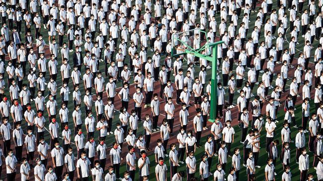 Students at the opening ceremony on the first day of the new semester in Wuhan last week. Picture: AFP