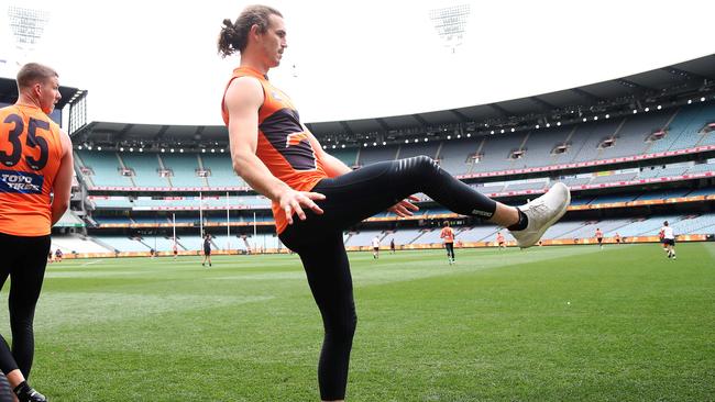 Phil Davis kicks the footy in his runners on the MCG, the day before the Grand Final. Picture: Phil Hillyard