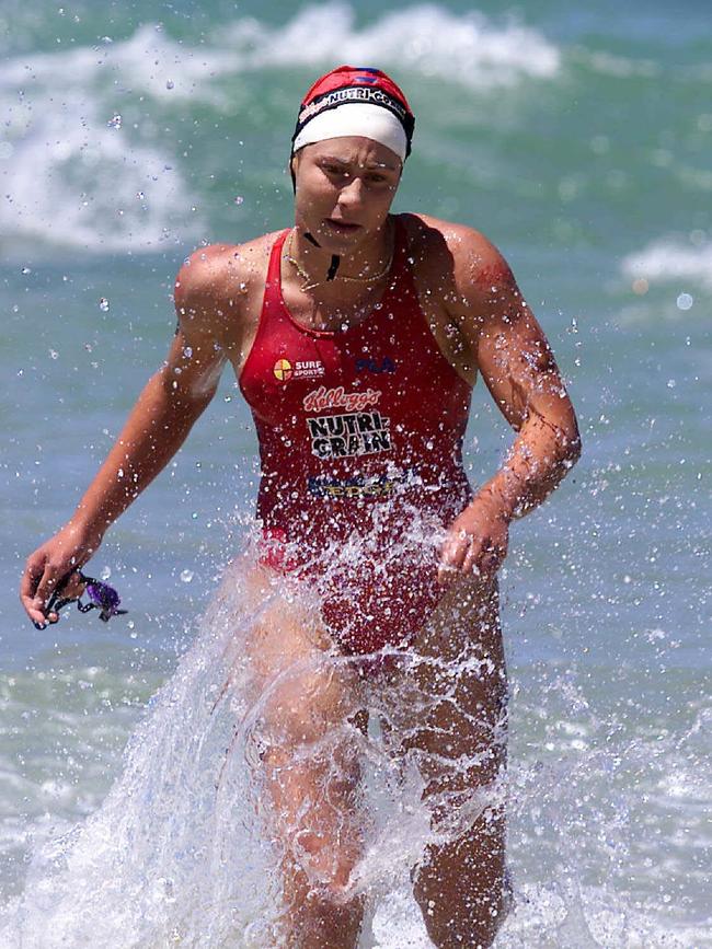 DEC 2000 – Kirsty Munroe. National Surf League at Manly Beach. Kirsty Munroe on her way to winning the Ironwoman race.