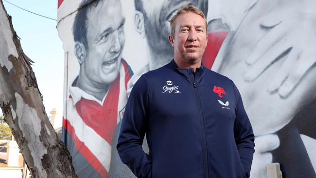 Pictured is Sydney Roosters coach Trent Robinson at club legends mural at Bondi Junction which now includes a portrait of retiring Sydney Roosters co-captain Jake Friend.Picture: Richard Dobson