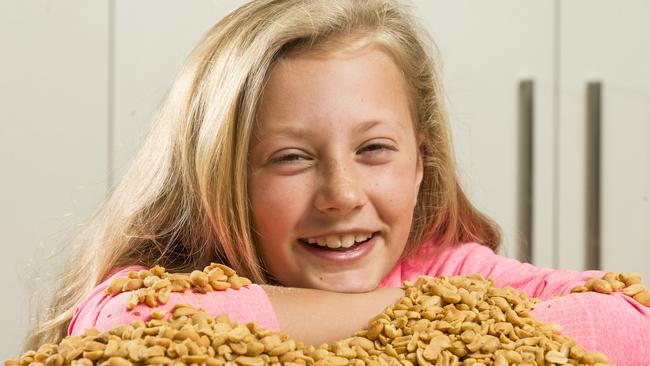 Olivia May, 10, has been cured of her peanut allergy with a new vaccine. Murdoch Children's Research Institute research has shown that four years after their breakthrough peanut allergy vaccine, participants in the trial are able to eat peanuts without having an allergic reaction. Picture: Eugene Hyland
