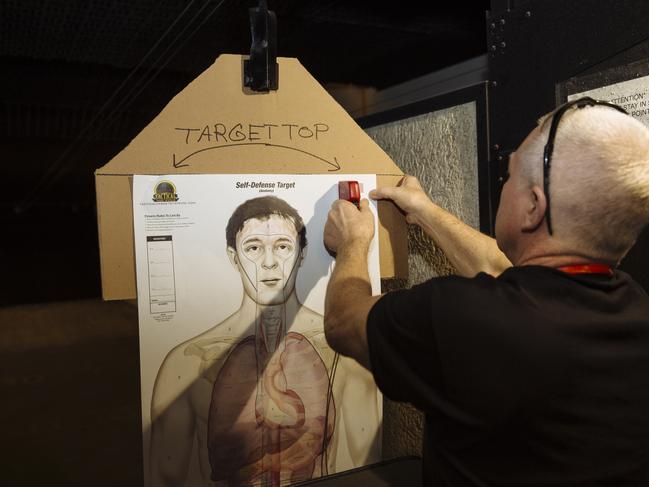 Scott Williamson prepares a target in the firing range at Jeff’s Guns and Ammo. Picture: Angus Mordant