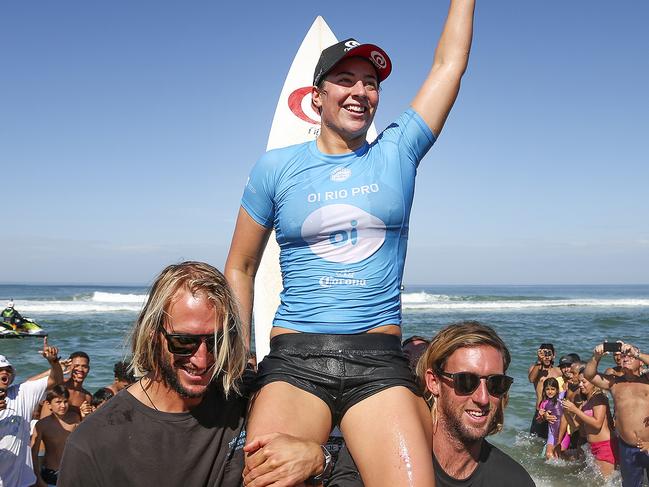 Supplied image obtained Monday, May 15, 2017 of Reinging World Champion Tyler Wright of Australia chaired up the beach by brother Owen Wright and friend Matt Wilkinson as the 2017 Oi Rio Women's Pro CHAMPION after defeating Johanne Defay of France in the final at Saquarema, Rio de Janeiro, Brazil.  Wright now shares the Jeep Leader Rankings No. 1 position with 6X World Champion Stephanie Gilmore of Australia.  (AAP Image/World Surf League, Daniel Smorigo) NO ARCHIVING, EDITORIAL USE ONLY