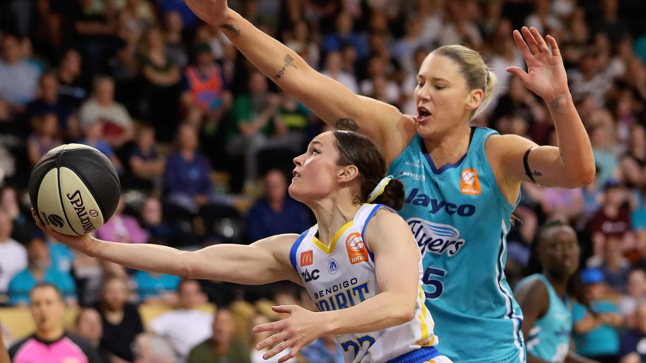 Kelly Wilson of the Spirit drives to the basket against Lauren Jackson of the Flyers.