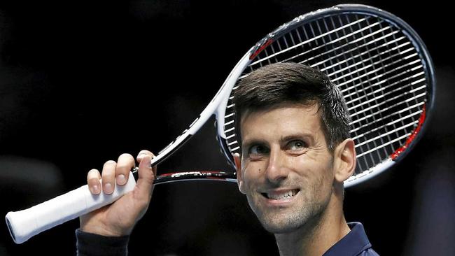 Novak Djokovic of Serbia celebrates winning match point against David Goffin of Belgium during their ATP World Tour Finals singles tennis match at the O2 Arena in London. Picture: Kirsty Wigglesworth