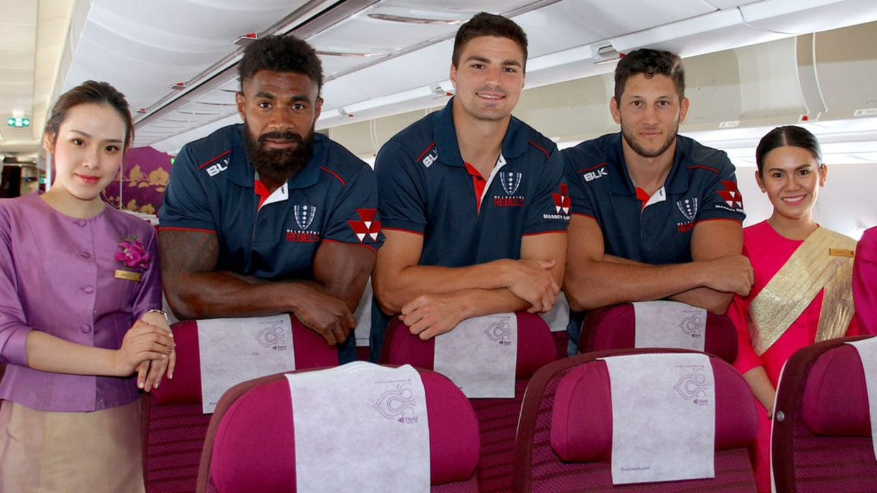 Rebels stars Marika Koroibete, Jack Maddocks and Adam Coleman on board a Thai Airways plane.