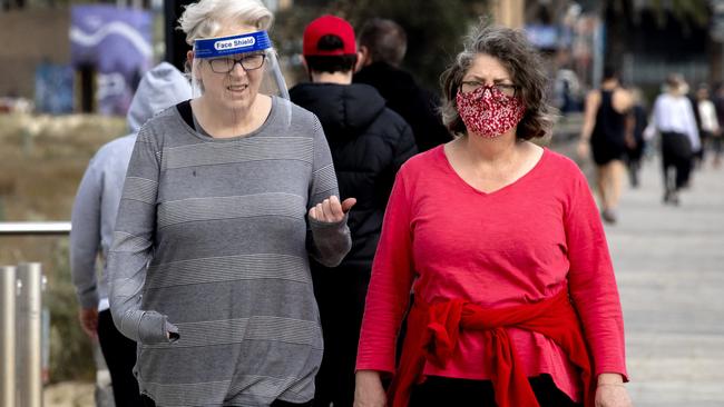 Melburnians will have to wear fitted face masks under new rules coming into effect. Picture: NCA NewsWire/David Geraghty