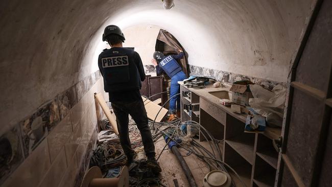 Journalists inside a tunnel that the Israeli army claimed was a “Hamas command tunnel” under the UNRWA compound. Picture: Jack Guez/AFP