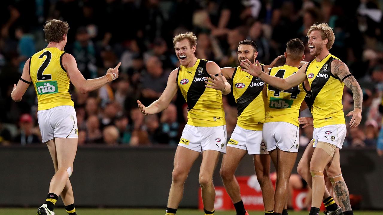 Richmond players celebrate their win over Port Adelaide. Photo: James Elsby/AFL Photos/Getty Images.