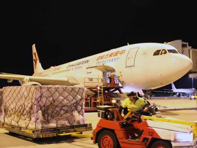 A supplied image obtained Thursday, April 2, 2020 of China Eastern flight touching down at Perth Airport, carrying tonnes of life-saving medical supplies and equipment that will be used to fight COVID-19. Mining billionaire Andrew Forrest will spend millions of dollars on procuring medical supplies and equipment to help Australia through the COVID-19 pandemic. His philanthropic organisation Minderoo Foundation and Fortescue Metals Group, which he founded and chairs, are chartering three aircraft from China to deliver more than 90 tonnes of medical supplies to Perth this week. (AAP Image/Supplied by Minderoo) NO ARCHIVING, EDITORIAL USE ONLY