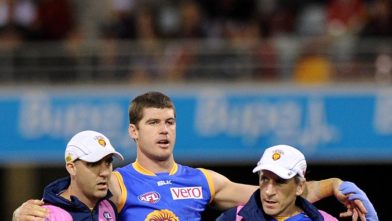 BRISBANE, AUSTRALIA - JUNE 14: Jonathan Brown of the Lions is assisted from the field during the round 13 AFL match between the Brisbane Lions and the Greater Western Giants at The Gabba on June 14, 2014 in Brisbane, Australia. (Photo by Matt Roberts/Getty Images)