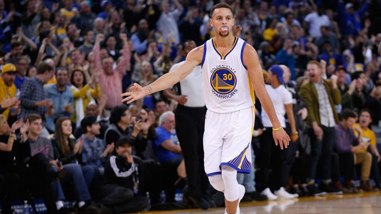 OAKLAND, CA - DECEMBER 28: Stephen Curry #30 of the Golden State Warriors reacts after he made a three-point basket against the Sacramento Kings at ORACLE Arena on December 28, 2015 in Oakland, California. NOTE TO USER: User expressly acknowledges and agrees that, by downloading and or using this photograph, User is consenting to the terms and conditions of the Getty Images License Agreement. Ezra Shaw/Getty Images/AFP == FOR NEWSPAPERS, INTERNET, TELCOS & TELEVISION USE ONLY ==