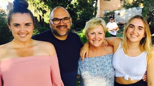 Sue Sofarnos with her husband John and daughters.