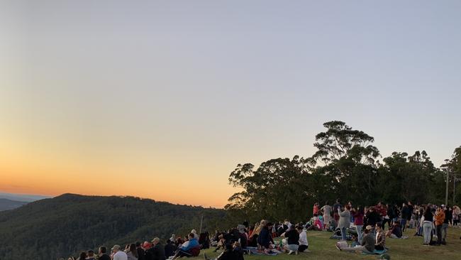 Hundreds of people have clapped as the sun went down at the lookout at Tamborine Mountain this afternoon. Photo: Emily Halloran