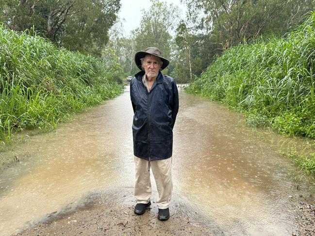 Bloomsbury resident Robert Hold was stranded on the wrong side of the Bruce Highway after travelling into Mackay for the markets. He couldn't make it home as water had swept over the highway at Calen, reducing it to rubble. He is pictured at Old Bowen Rd, St Helens, a shortcut that was also blocked to traffic. January 14, 2023. Picture: Heidi Petith