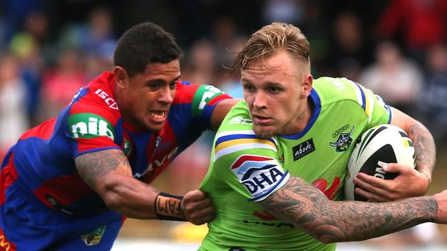 Raiders vs. Newcastle Knights trial match at Seiffert Oval in Queanbeyan, NSW. Knights Dane Gagai dives to tackle Raiders Blake Austin.