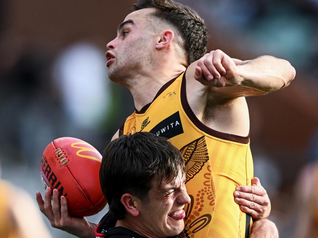 ADELAIDE, AUSTRALIA - JUNE 03: Karl Amon of the Hawks tackled by Zak Butters of Port Adelaide during the round 12 AFL match between Port Adelaide Power and Hawthorn Hawks at Adelaide Oval, on June 03, 2023, in Adelaide, Australia. (Photo by Mark Brake/Getty Images)