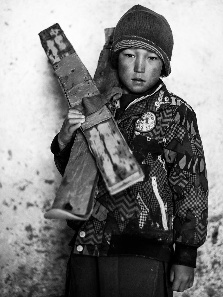 Omid, who doesn’t know his age, stands for a portrait with his homemade skis in Aub Bala’s village mosque. Aub Bala, ‘High Water’, is the farthest village up the Fuladi Valley in central Afghanistan’s Bamiyan Province, so named because it is the closest to the source of the valley’s water, which comes off the mountains in snow-melt and rain, deeper in the valley, beyond where the single road reaches. Series Name: High Water Skiing first came to Aub Bala in 2009, when two staff members of the Agha Khan Foundation visited the village while mapping Bamiyan’s snowfields for the purpose of producing a guide book for skiers. Since then, boys in the village have built their own based on what they remember of the visitors’ equipment. Picture: Andrew Quilty, Australia, Shortlist, Professional, Portraiture (Professional competition), 2018 Sony World Photography Awards