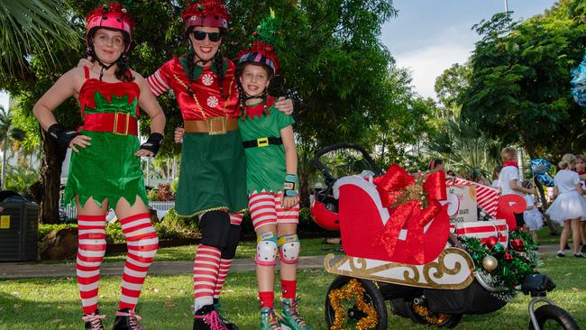 Matilda Culgan, Libby Culgan and Harper Culgan as thousands of Territorians braved the tropical heat for A Very Darwin Christmas Pageant. Picture: Pema Tamang Pakhrin