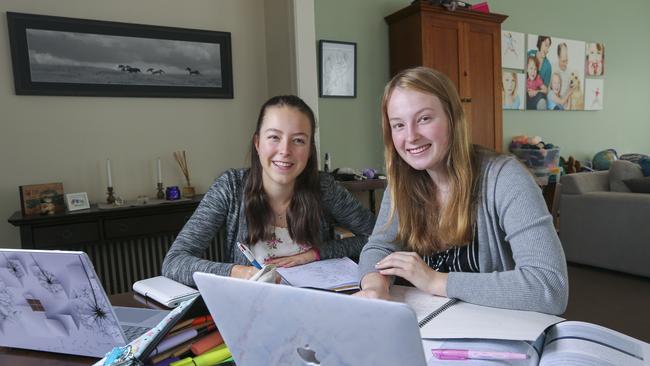 Strathcona Girls Grammar students, L/R Alyssa McKnight (Year 9) and Cassie McKnight are ready to learn from home. Picture by Wayne Taylor