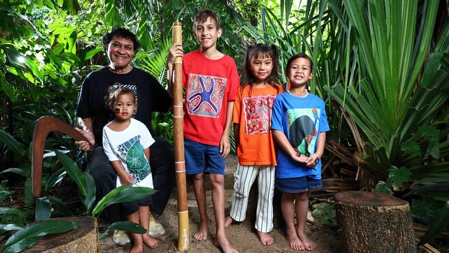 Well known and respected Indigenous artist Munganbana, also known as Norman Miller, has launched a range of fashion items, including shirts for adults and children, featuring his most popular and distinctive artwork. Artist Norman Miller, Timote Fukofuka, 3, Caiden Villaflor, 11, and Dream Barlow-Fukofuka, 6, model Munganbana Style Up Fashion T shirts. Picture: Brendan Radke