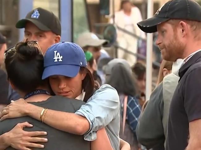 Meghan Markle hugged a victim of the fires alongside Prince Harry. Picture: CBS