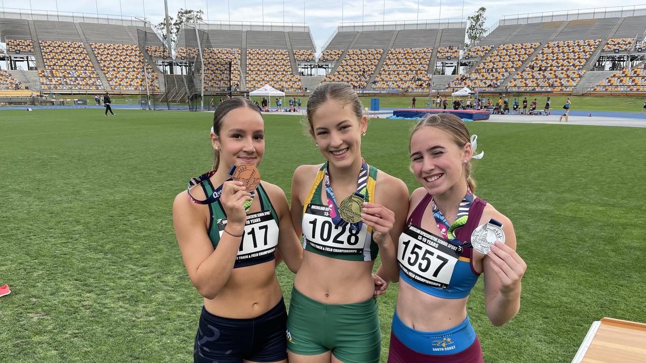 St Aidan's Anglican Girls' School sprint ace Eloise Nealon, pictured middle, was in gold medal winning form. Pictured with bronze medallist Sienna De Young and South Coast's Zarayah Williams (silver).