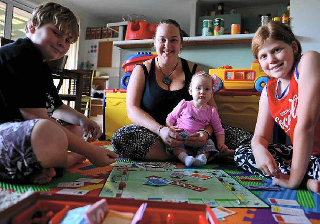 CUTTING COSTS: Tanya Norman, pictured with Parker Bailey, Charlotte Altoft and Hayley Altoft, turns to board games to keep family entertainment costs down. Picture: john mccutcheon