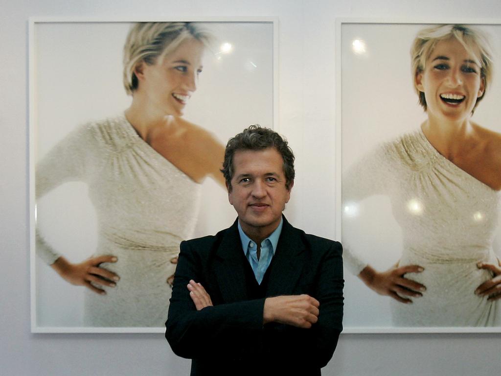 Peruvian photographer Mario Testino in front of his photographs of Diana, Princess of Wales at exhibition of his work at Kensington Palace in London 2005.